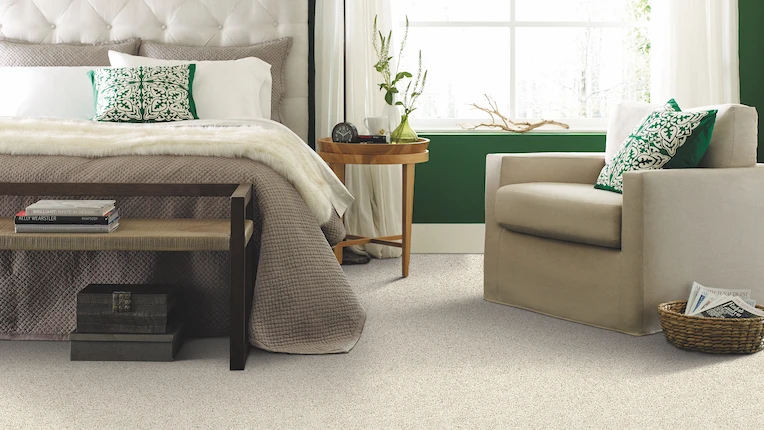 carpet-in bedroom with green walls